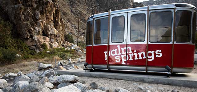 Palm Springs tram car on ground.